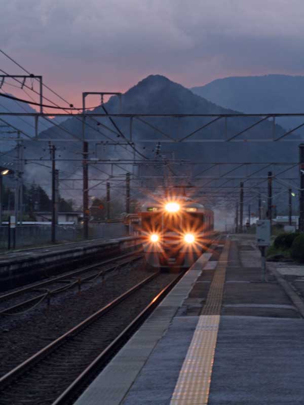 train headlights approaching Nojiri station